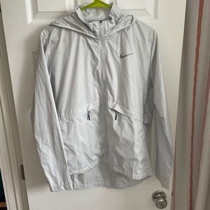 NIKE Women’s Running Packable Rain jacket. Full zip, size medium, never worn
